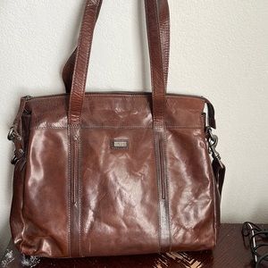 Leather crossbody or satchel with laptop pocket. Great for traveling.